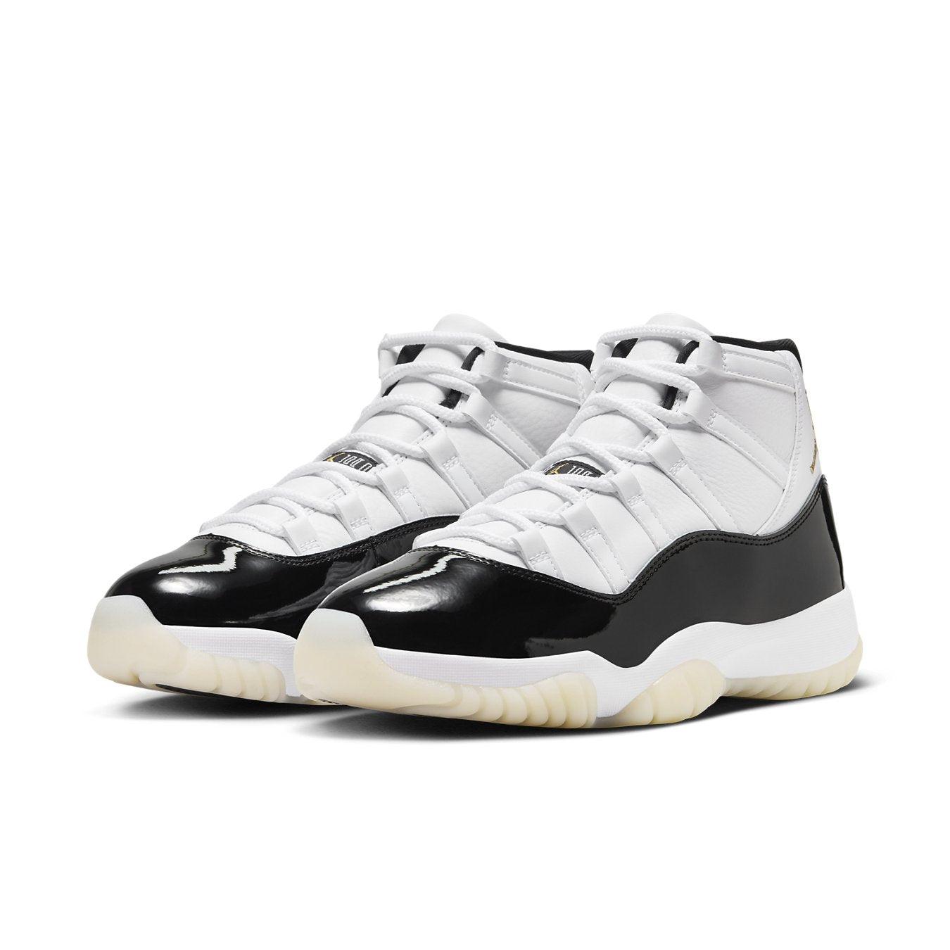 Air Jordan 11 Retro DMP Gratitude 2023 in white and black with a sleek patent leather finish.