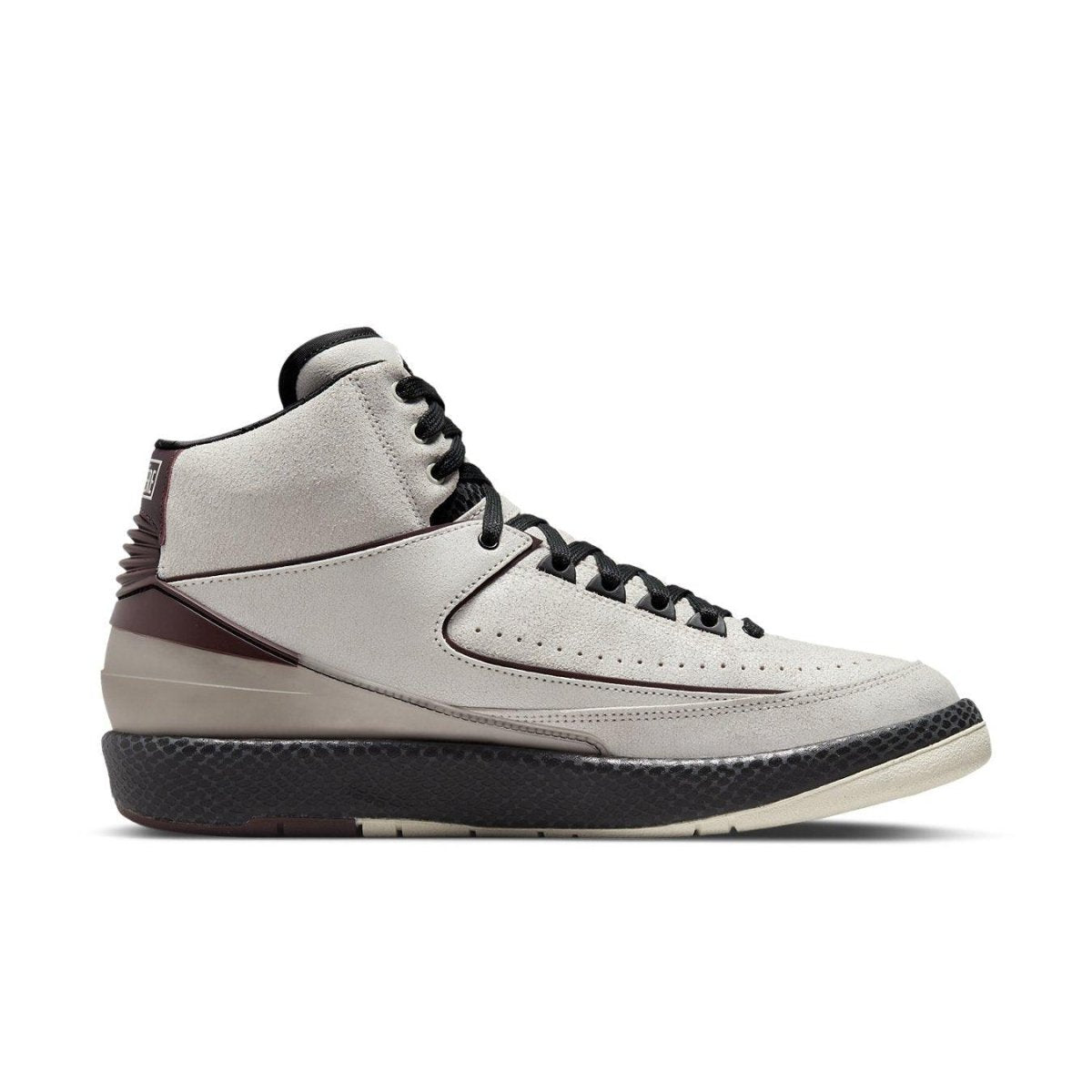 Jordan 2 Retro A Ma Maniére Airness sneakers in cracked white leather with burgundy accents.