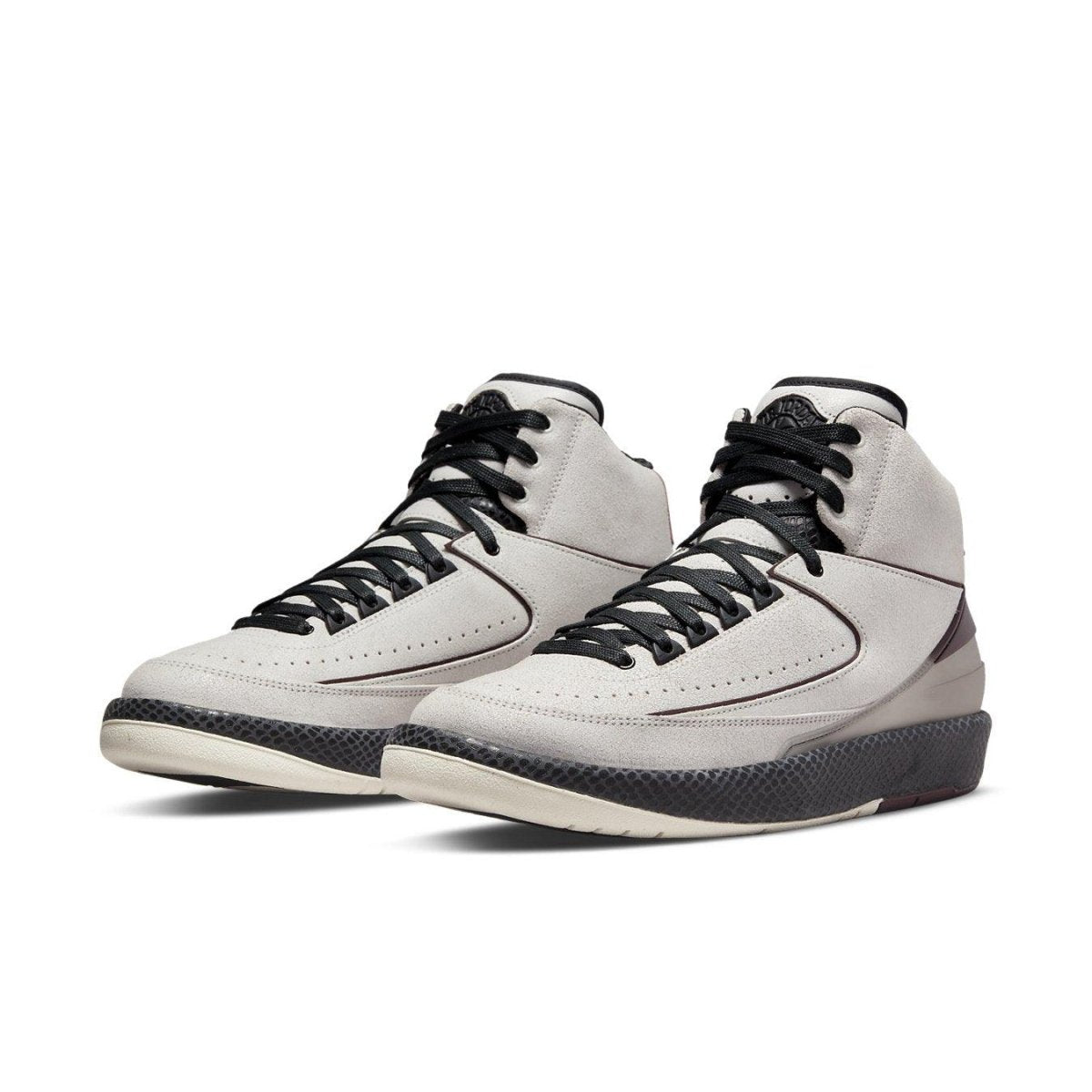 A Ma Maniére x Air Jordan 2 Retro SP 'Airness' sneaker in light grey with burgundy accents and translucent heel.