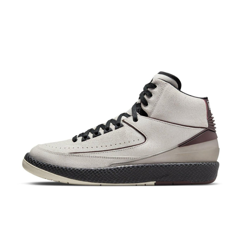 Air Jordan 2 Retro A Ma Maniére 'Airness' sneaker with cracked leather upper and bordeaux accents.