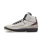 Air Jordan 2 Retro A Ma Maniére 'Airness' sneaker with cracked leather upper and bordeaux accents.