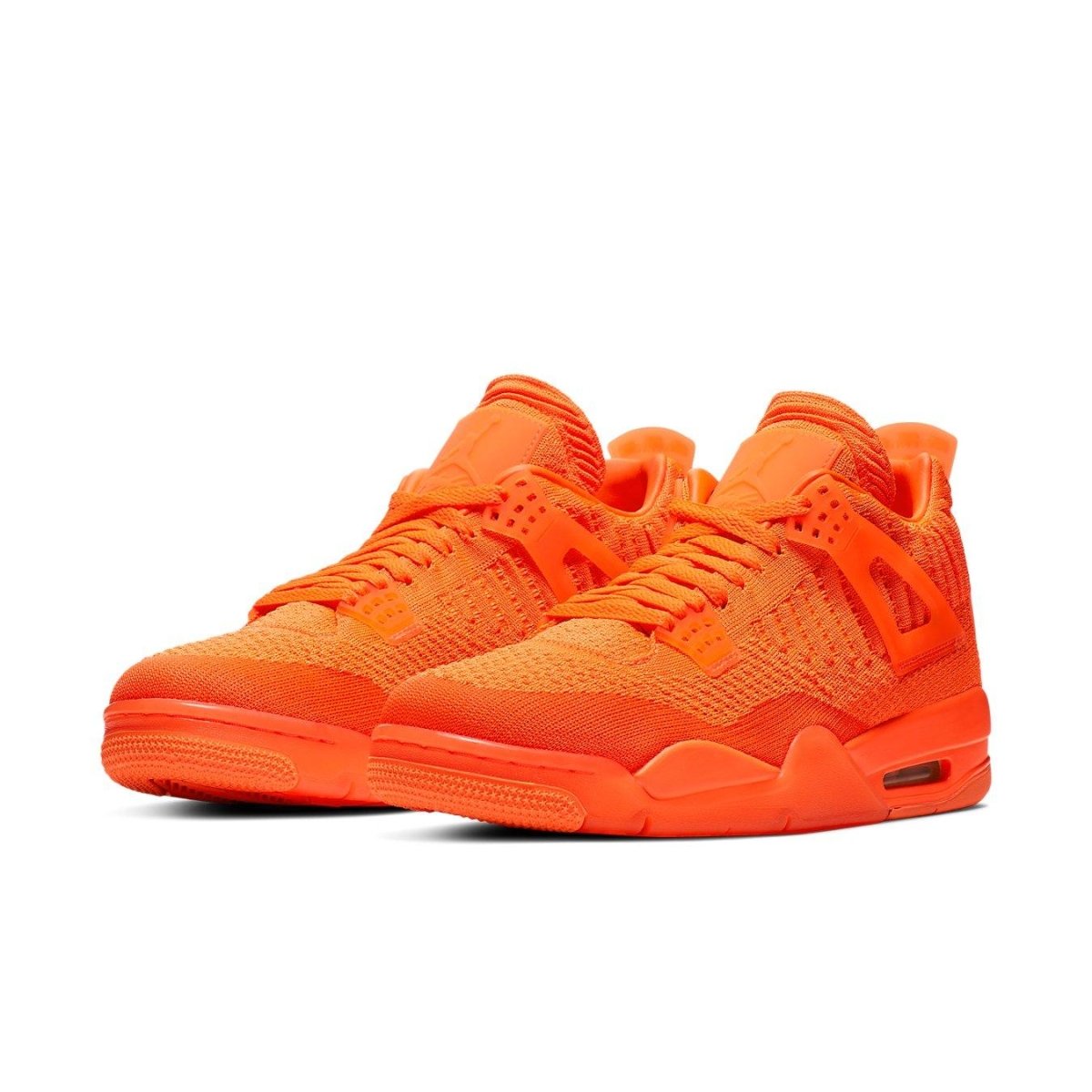 Jordan 4 Retro Flyknit in Total Orange, showcasing innovative design and vibrant color.