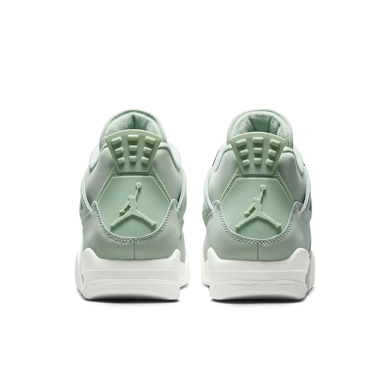Jordan 4 Retro Seafoam Sail women's sneakers, featuring a mint green and white design from the back view.