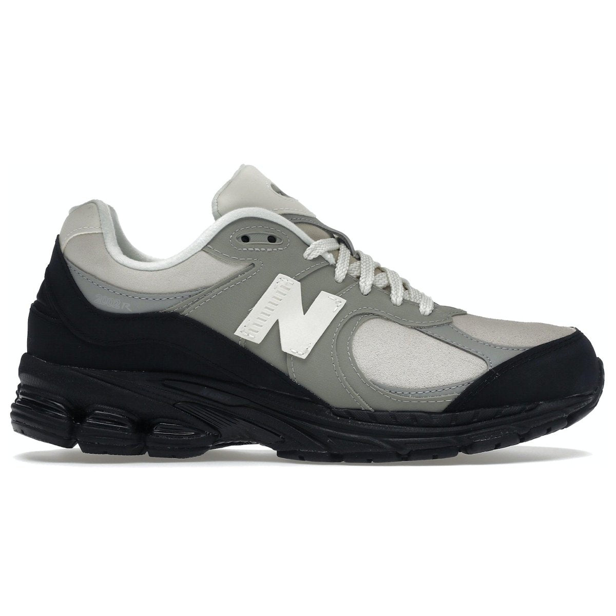 New Balance 2002R The Basement in stone grey and black with premium materials for comfort and style.