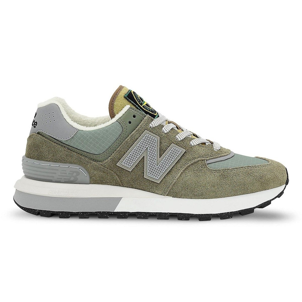 New Balance 574 Legacy sneakers in steel blue and green, featuring military style and suede overlays.