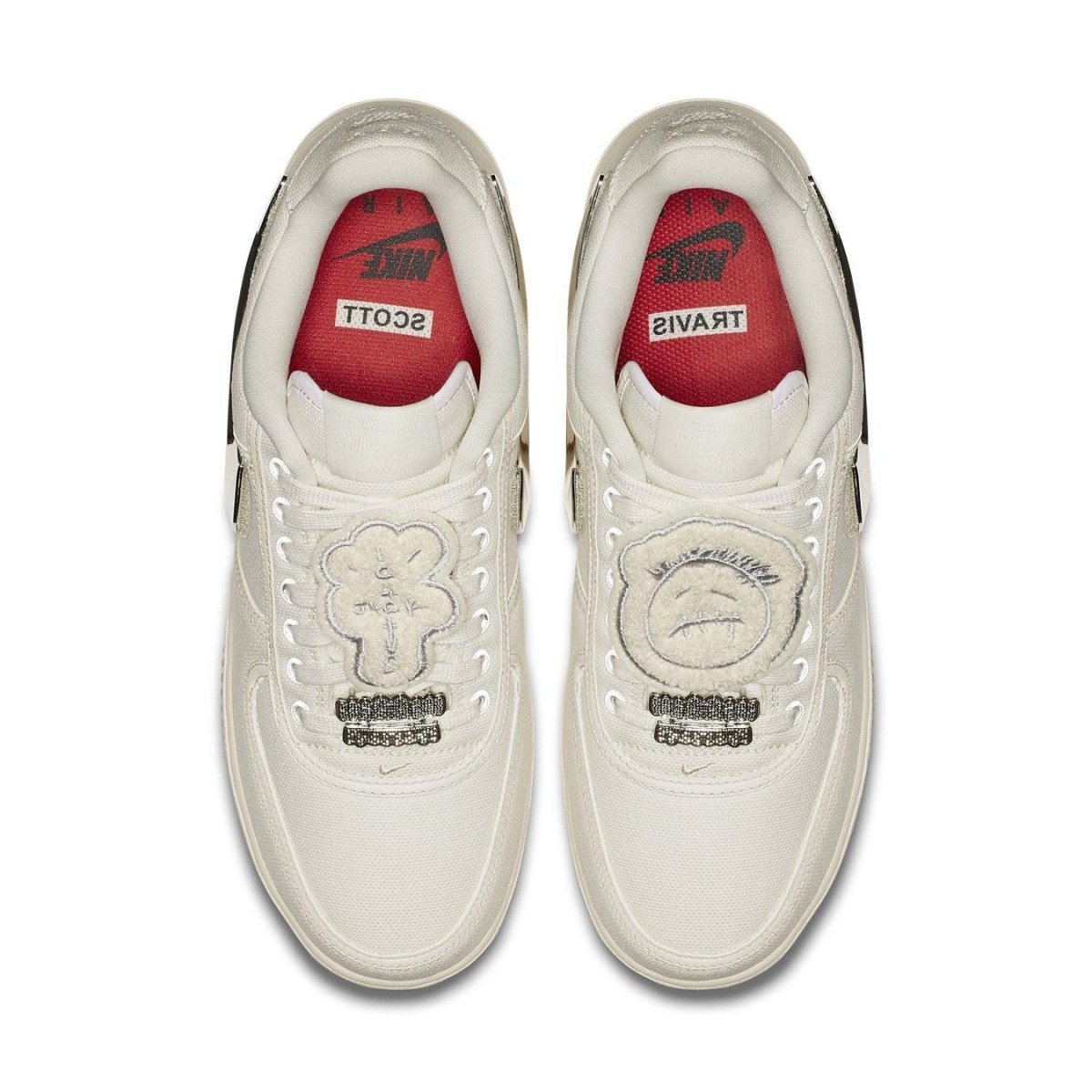 Nike Air Force 1 Low Travis Scott Sail sneakers with unique lace bling and red insoles featuring trademark logos.