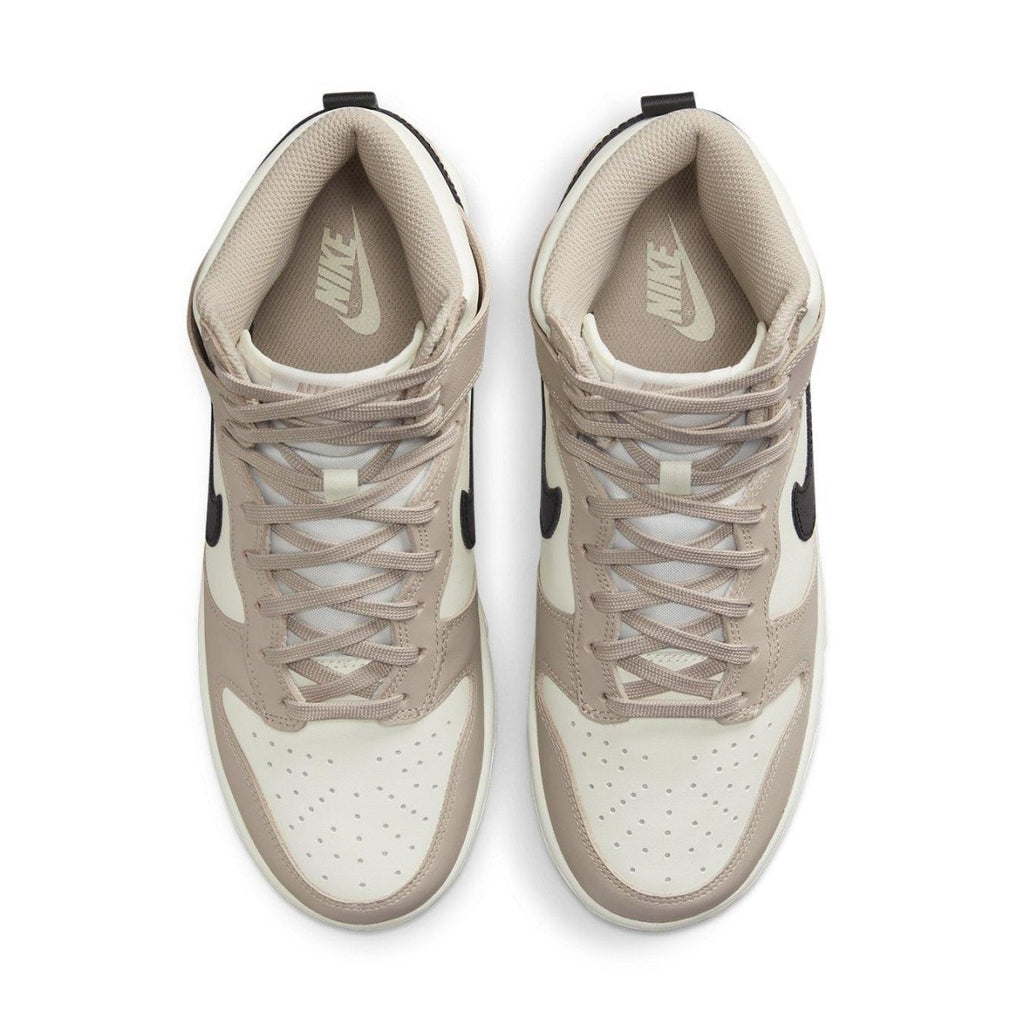 Nike Dunk High Fossil Stone women's sneakers with beige and ivory leather upper and black Swoosh.