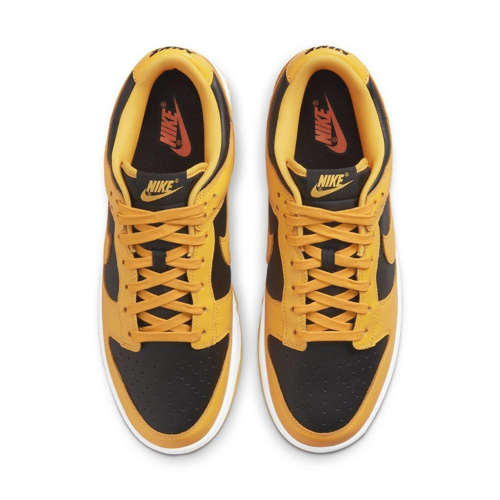 Nike Dunk Low Championship Goldenrod 2021 sneakers in black and yellow colorway, featuring classic design and modern updates.