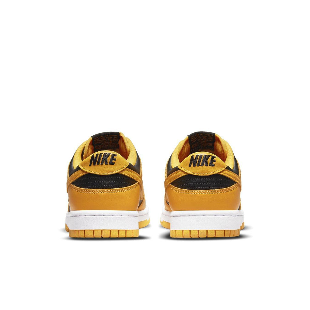 Nike Dunk Low Championship Goldenrod (2021) in black and yellow-ochre, showcasing stylish back view.