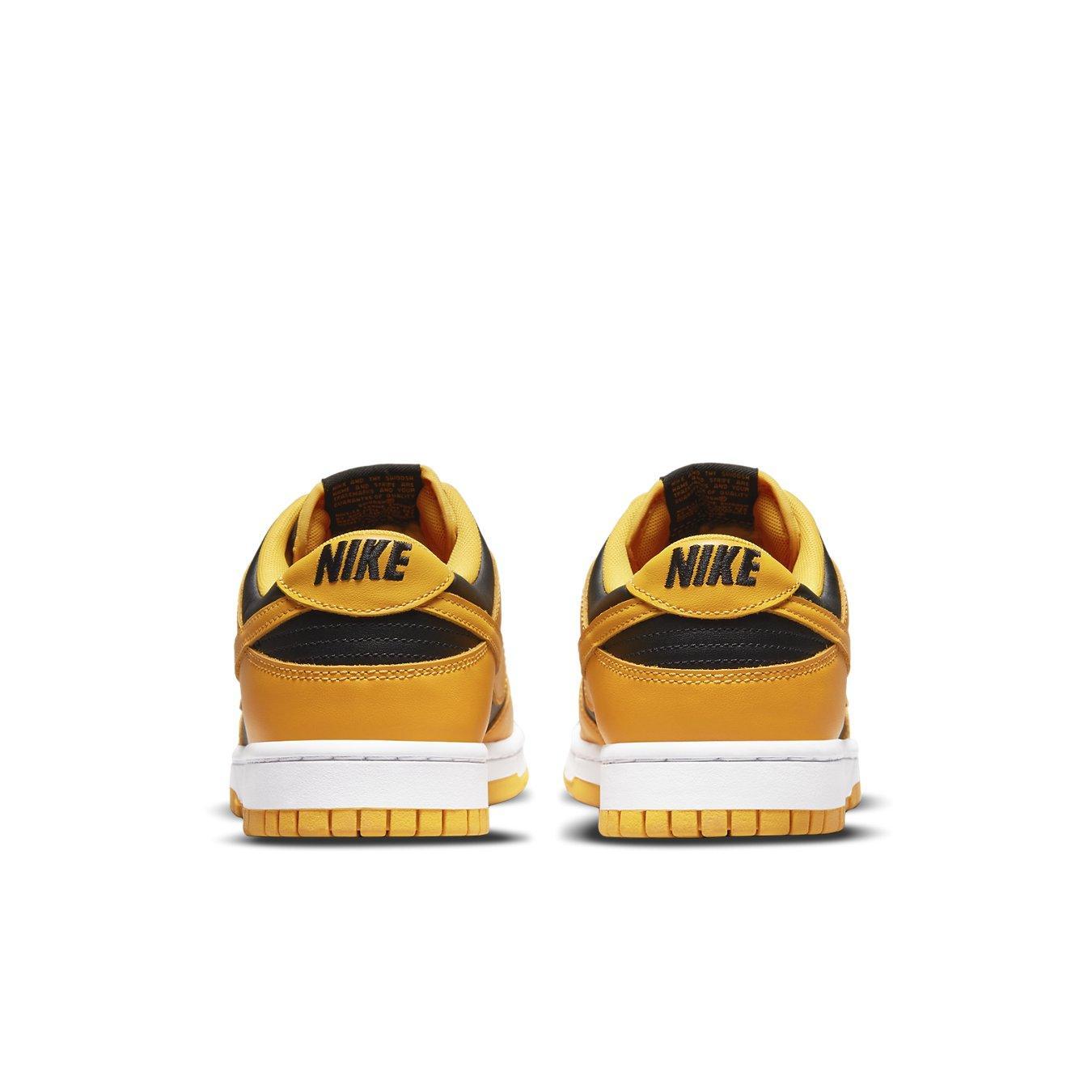 Nike Dunk Low Championship Goldenrod (2021) in black and yellow-ochre, showcasing stylish back view.