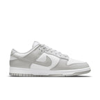 Nike Dunk Low Grey Fog sneakers in white and light grey leather design, featuring signature Swoosh logo.