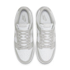 Nike Dunk Low Grey Fog sneakers from above, featuring a white leather base and light grey overlays.