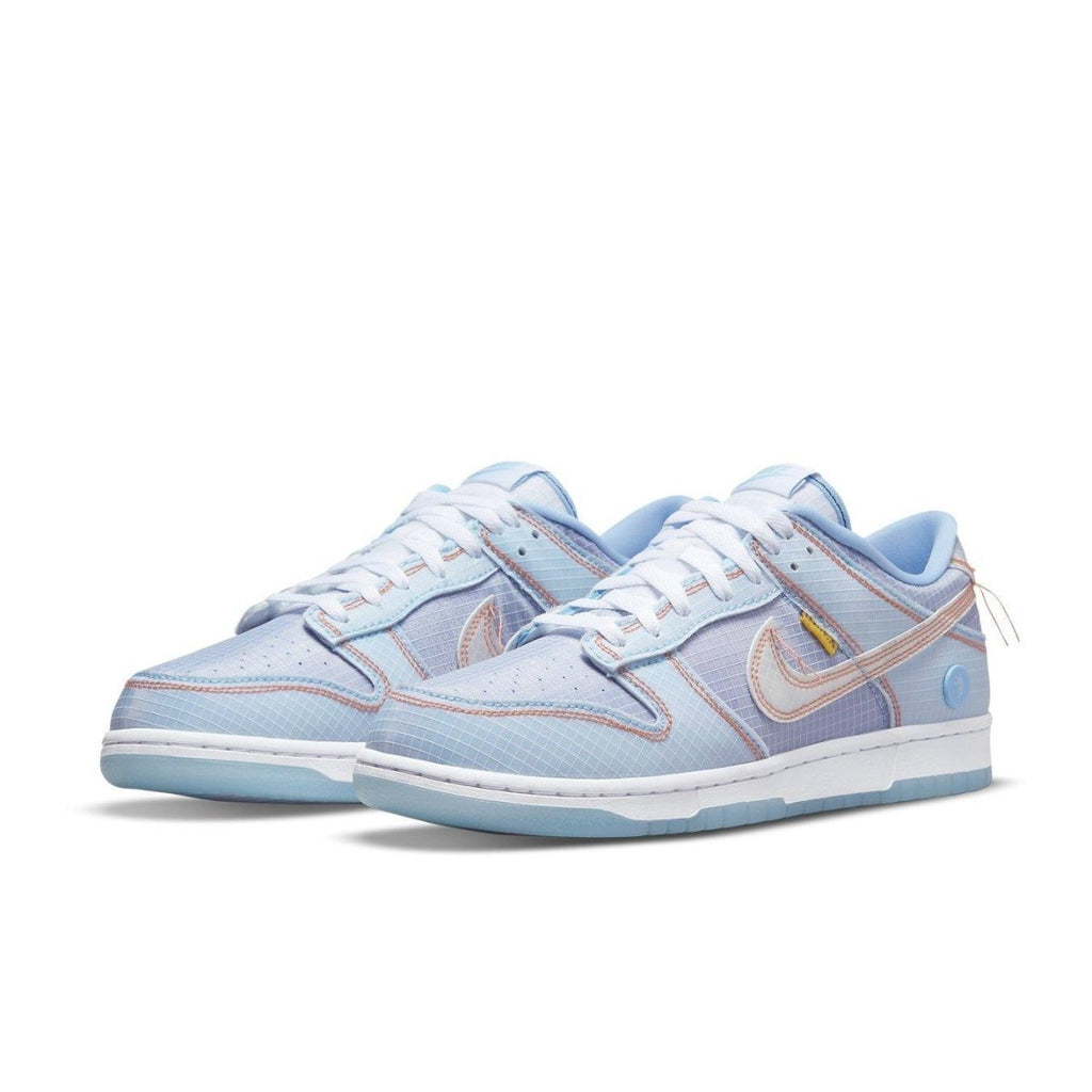 Nike Dunk Low Union Passport Pack Argon sneakers in blue, inspired by 90s streetwear and culture.