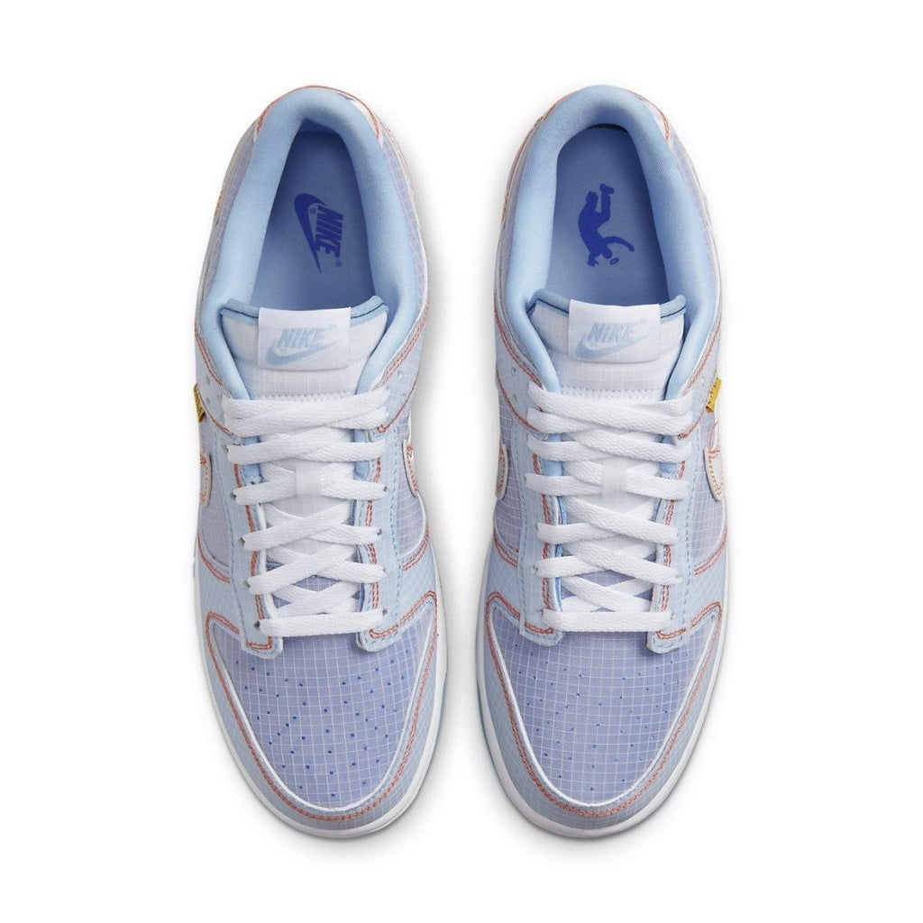 Nike Dunk Low Union Passport Pack Argon sneakers in light blue and white with yellow accents, top view.