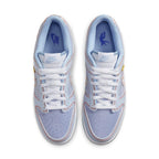 Nike Dunk Low Union Passport Pack Argon sneakers in light blue and white with yellow accents, top view.
