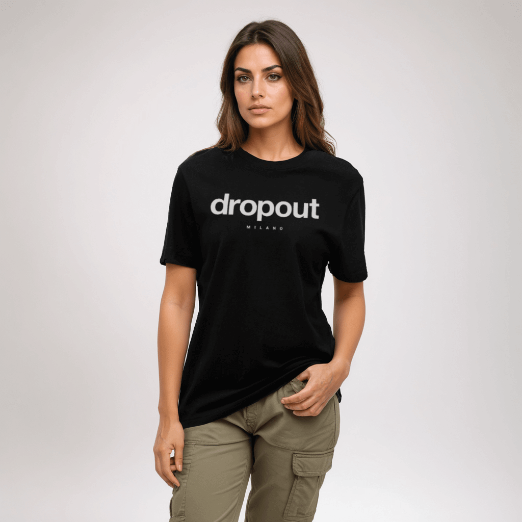 Woman in a relaxed fit black tee with 'dropout' graphic, offering casual comfort and stylish confidence.