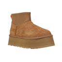 Tan suede platform shoe on a white background