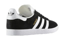 Black Adidas sneaker with white stripes on a white background