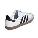 White sneaker with black stripes on a white background