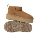 Tan ankle boot with sole showing on a white background