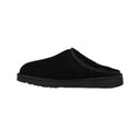 Black slip-on shoe on a white background